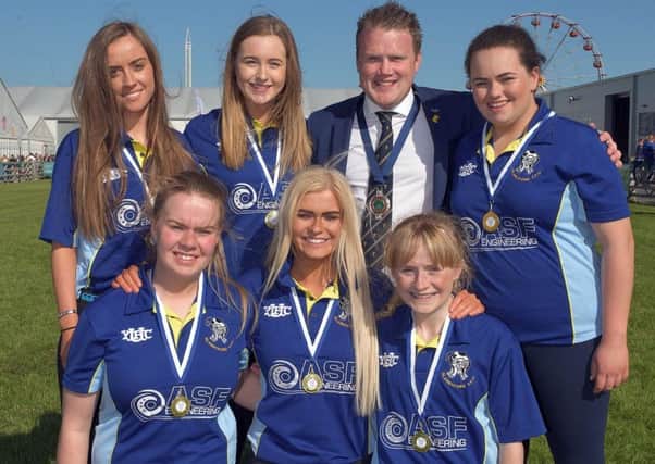 Pictured are the team members from Glarryford YFC who were crowned champions, coming first in the YFCUs ladies football final held at the Balmoral Show 2018. Congratulating the girls on their achievement is YFCU president James Speers