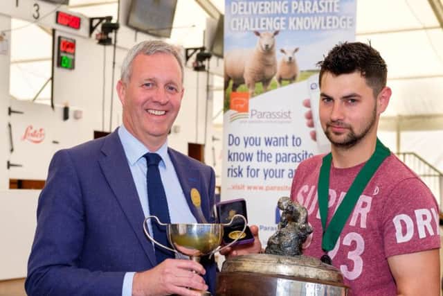 Raymond Irvine, Zoetis, right with Jack Robinson, Claudy winner of the Zoetis sponsored Royal Ulster National Sheep Shearing Championship Finals at Balmoral Show. Photograph: Columba O'Hare/ Newry.ie