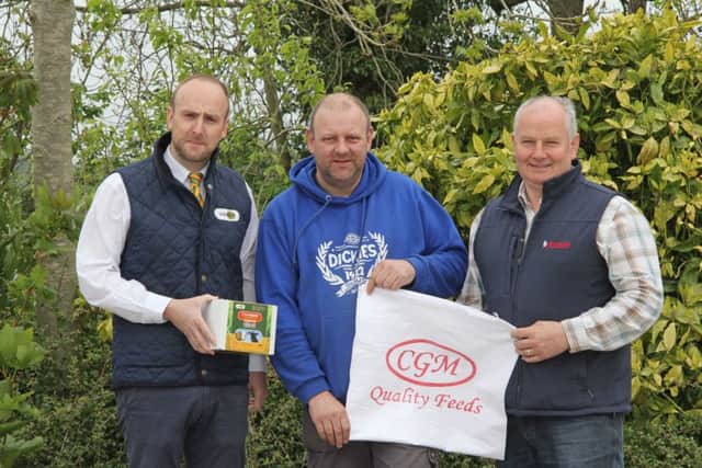 All set for next week's NI Simmental Cattle Breeders' Club show and sale in Ballymena Mart are club committee member Matthew Cunning, centre, with sponsors Neill Acheson, Animax, and Frances Connon, Connon General Merchants. Picture: Julie Hazelton