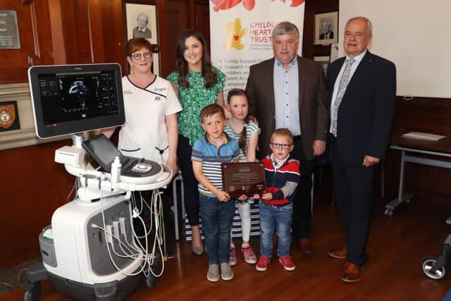 Press Eye - MW Advocate - RVH Sick Children 
18th May 2018

(L-R) Lorraine Davidson, Amy Hewitt, William, Grace and Harry Powell, Hampton Hewitt and Dr Brian Craig


Event - Lunch of a new portable echocardiogram machine.