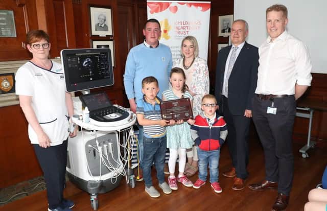 Press Eye - MW Advocate - RVH Sick Children 
18th May 2018

(L-R) Lorraine Davidson, Richard and Ronda Powell with their children William Grace and Harry, Dr Brian Craig and Dr Brian Grant.

Event - Lunch of a new portable echocardiogram machine.