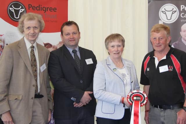 Brian Walker, left, chairman, and Ann Orr, secretary, Pedigree Cattle Trust, welcome Aberdeen Angus Club members, Alan Morrison, chairman, and Freddie Davidson, to the breakfast meeting held at Balmoral Show.