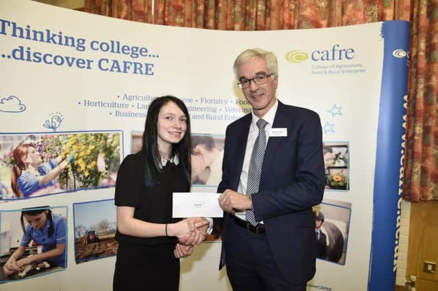 Sarah Ross, Carrickfergus, Co. Antrim, receives the Blue Frog Bedding Bursary which is worth Â£1,000. The bursary was presented, on behalf of Blue Frog Bedding, by Norman Fulton, Head of Food and Farming Group, DAERA. Picture: Michael Cooper