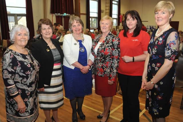 Isobel Halliday, Sophia Maybin and Diane Murdoch are seen with guests Elizabeth Warden, Federation Chairman of WI Northern Ireland; Councillor Audrey Wales and Michelle McDaid, Air Ambulance. GB1735D18