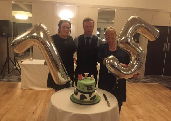Cutting of the cake with Amy Kirkpatrick club leader, Chrissy Clarke club president and Rita McNeill