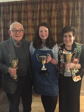 Guest speaker Edward Campbell MBE Drumahoe Veterinary Clinic along with wife Dorothy Campbell and grandchild Aoife Campbell with all her awards
