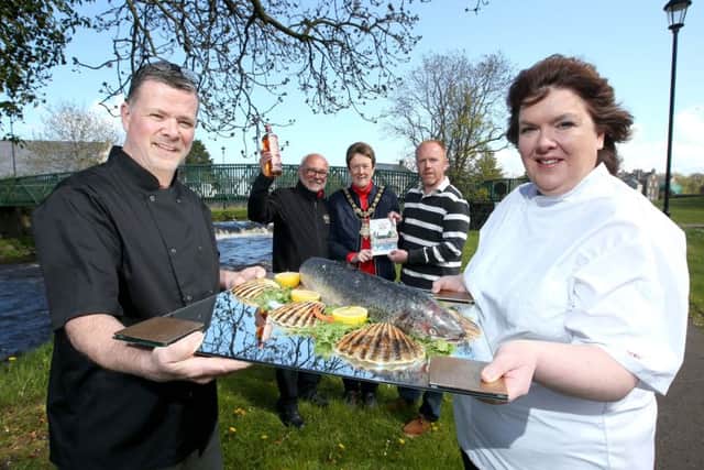 Gary Stewart and Paula McIntyre pictured with Niall Mehaffey from Bushmills Distillery; the Mayor of Causeway Coast and Glens Borough Council, councillorJoanBaird; and Tim Delargy from Department of Environment, Agriculture and Rural Affairs at the launch of Bushmills Salmon andWhiskey Festival