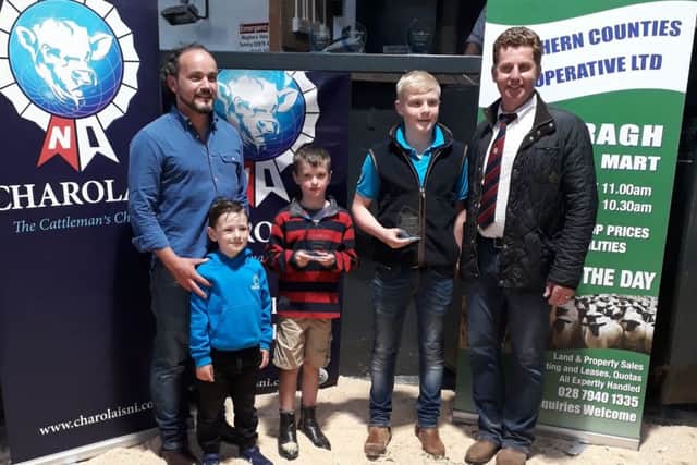 Junior winners of youth stock judging at Swatragh Mart Conor Phair and Andrew Hamel  with judge Gary Henderson and Garry Scott, CIP Insurance Brokers Ltd, sponsors of the event  pictured with his son