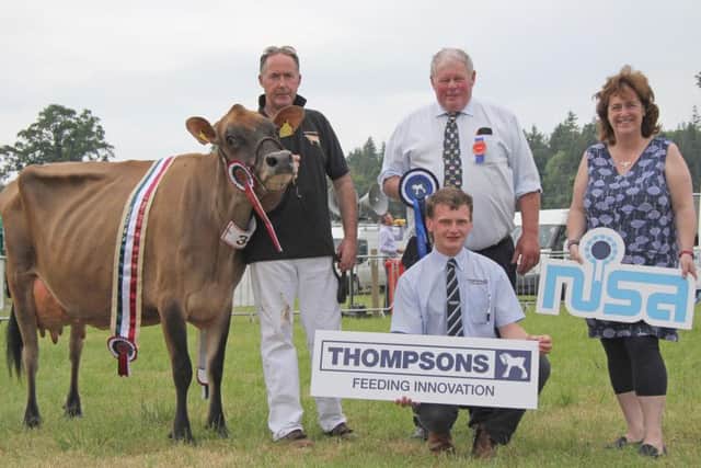 Ashley Fleming's Jersey cow Quintrell Kyros Indigo qualified at Armagh Show for the Thomspons/NISA Dairy Cow Championship. Adding their congratulations are judge Daivd Boyd, Glaslough; Fiona Patterson, chairman, NISA; and Andrew Douglas, Thompsons. Picture: Julie Hazelton/Kevin McAuley Photography Multimedia