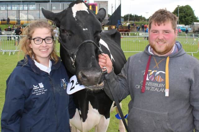 April Baldock, from Kent, and John McLean, from Bushmills with the Inter-Breed dairy champion at Ballymena Show 2018 - Priestland Shot J Rose