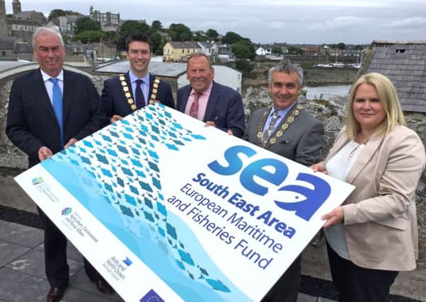Launching the Â£2.4 million Community-lrd Local development scheme at Ardglass today are from left to right: DAERA Marine and Fisheries Director Dr. John Speers, Mayor of Ards and North Down Council Richard Smart, Chair of SEAFLAG Alderman Angus Carson, Chairman of Newry Mourne and Down District Council Mark Murnin and Director of Regeneration & Tourism, Newry, Mourne and Down Council, Marie Ward