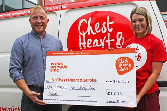 Eamon McGarry, left, presents Katie McKeown from Northern Ireland Chest Heart and Stroke with a cheque for Â£1035 raised in his fathers memory.
