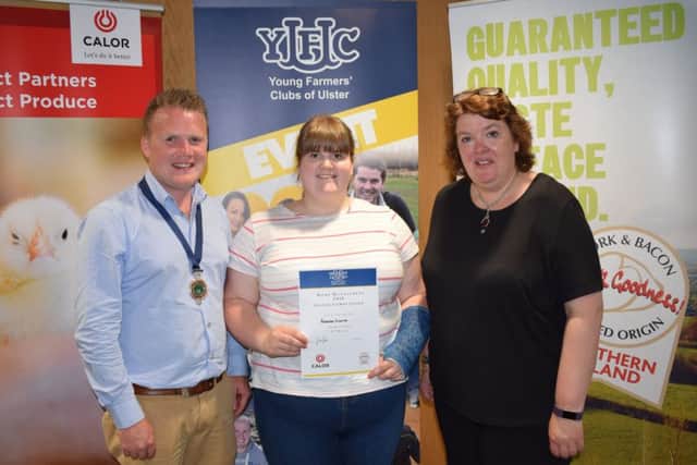 Rebecca Cromie, Rathfriland YFC was awarded second place in the home management final. Rebecca (centre) is pictured with YFCU president, James Speers (left) and Paula McIntyre (right)