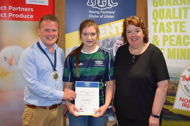 Nicola Mitchell, Annaclone and Magherally YFC was awarded second place in the junior section of the home management final. Nicola (centre) is pictured with YFCU president, James Speers and Paula McIntyre (right)