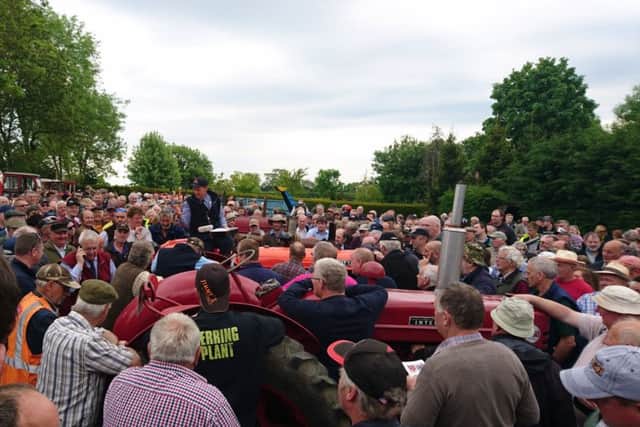 A vintage tractor auction has raised more than Â£300,000 thanks to the expertise of one of the countrys leading rural land specialists