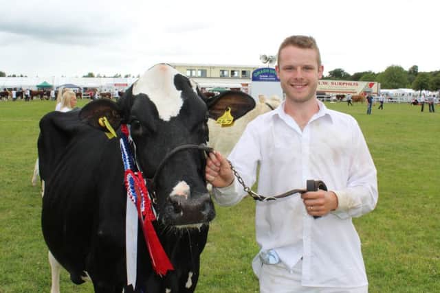 Andrew McLean, from Donaghmore, with the Holstein champion at this year's Omagh Show