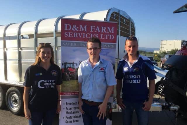 D and M Farm Services Ltd trade stand with salesman David and club members Lynne Montgomery and Curtis Nutt