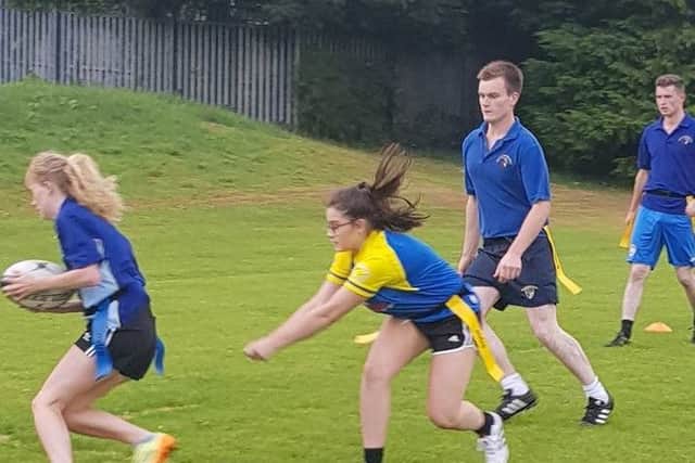 YFCU members pictured taking part in the tag rugby heats at Rainey Endowed School
