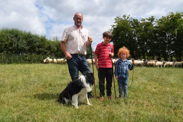 Paul Butler, Martinstown, third generation farmer and his sons Shay and Jamie