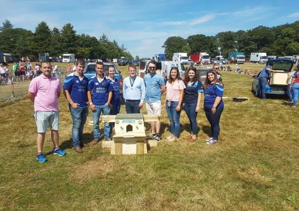 Pictured with judge, Richard Harrison (left) are members of City of Derry YFC who took home first place in the 2018 Build It competition. Also pictured is YFCU president, James Speers (centre), Andrew Gracey, Grassroots Challenge, (fourth from right) Linzi Stewart, Co Down chair (third from right) and Kristina McKeag, Co Down secretary (second from right)