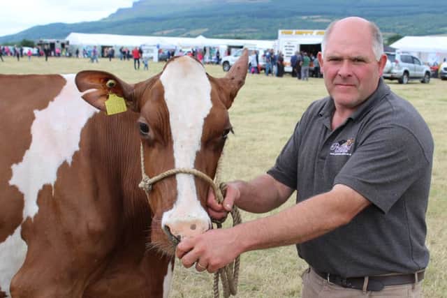 Iain McLean, frm Bushmills, with the Dairy Inter-Breed Champion at Limavady Show