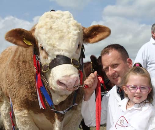 Jonny and Sophie Hazelton of Dungannon with their Simmental champion
