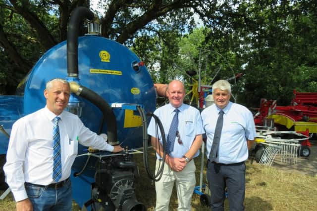 Sales team, Mr Aaron McFarland pictured with Bryan Hunter ( Fleming Agri. ) and Stuart Henry ( Merlo UK ) pictured beside a Fleming 1600 gallon Tanker.