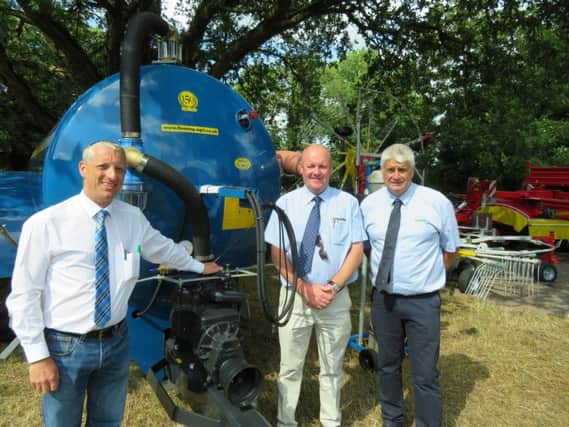 Sales team, Mr Aaron McFarland pictured with Bryan Hunter ( Fleming Agri. ) and Stuart Henry ( Merlo UK ) pictured beside a Fleming 1600 gallon Tanker.