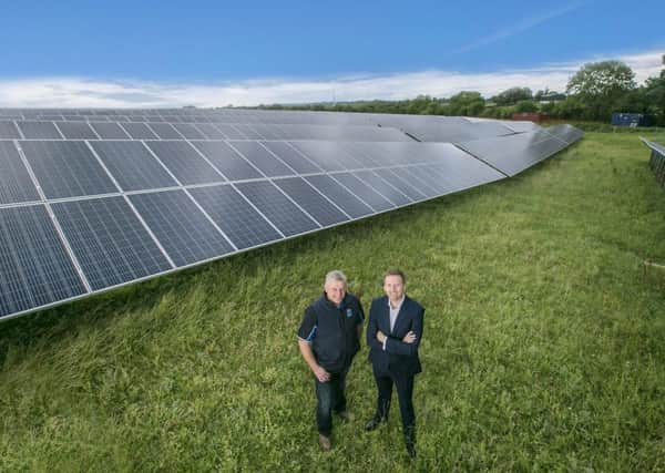 Pictured at the solar farm at Dale Farms Dunmanbridge cheese facility are Chris McAlinden, Group Operations Director alongside Farmer David Beggs, one of the Dale Farm cooperative members who supplies the company with milk from his farm nearby in Cookstown. PICTURE: BRIAN MORRISON