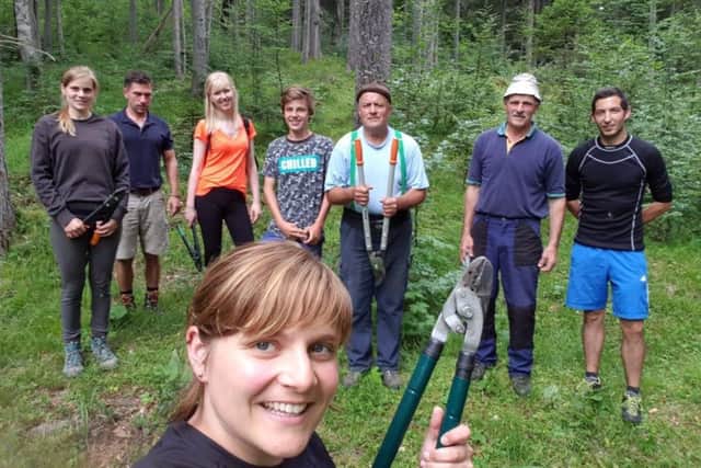 Gemma pictured (third from left) in rural Austria with some local people