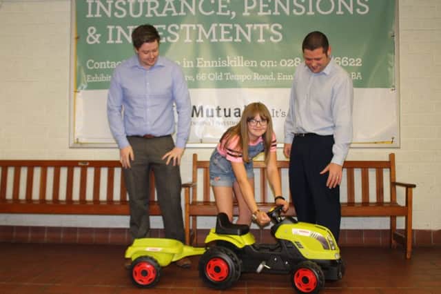 Martin Murray and Glen Stewart, NFU Mutual presenting Gemma Moncrief with her prize.