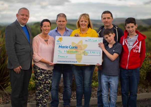 Left to right: Rev Ivan Dingmore, Catherine Monaghan and husband Ted, Sheena Havlin Marie Curie fundraising manager, Gerard Monaghan. Brothers Conor and Stephen Monaghan. Missing from photo: Damian Monaghan and Ed Bradley
