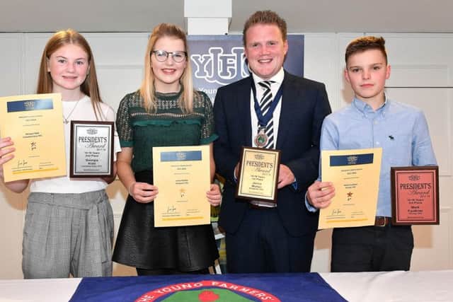 14-16 age category (left to right) Georgia Kidd, Lisnamurrican YFC (second place), Jenna Mullan, Dungiven YFC (first place), James Speers, YFCU president, and Mark Faulkner, Finvoy YFC (third place)