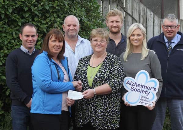 Holstein NI has presented a cheque for Â£8,500 to the Alzheimer's Society. Community fundraiser Amanda McGale received the cheque from club chairman Jason Booth, club secretary John Martin; and the Irwin Family, Alan, Sylvia, David and Heidi, hosts of the 2018 Open Day. Picture: Julie Hazelton