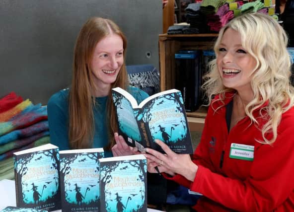 Local author Claire Savage at the 'Meet the Makers' craft event in the Giant's Causeway Visitor Centre with Jennifer Michael from the National Trust