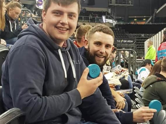 Ben Martin and Chrissy McMaster play Chuck the Puck at Belfast Giants