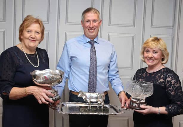 Judith Waring congratulates Malcolm and Caroline McLean, Donaghmore, on winning a number of awards with their Relough Herd, including the Ballybeeny Crystal for the best overall herd in the annual herds inspection competition. McAuley Multimedia
