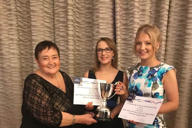 Left to right: Valeria Cochrane (presenting new cup that she sponsored this year) with Rachel Lamont and Ruth Adams from Coleraine YFC
