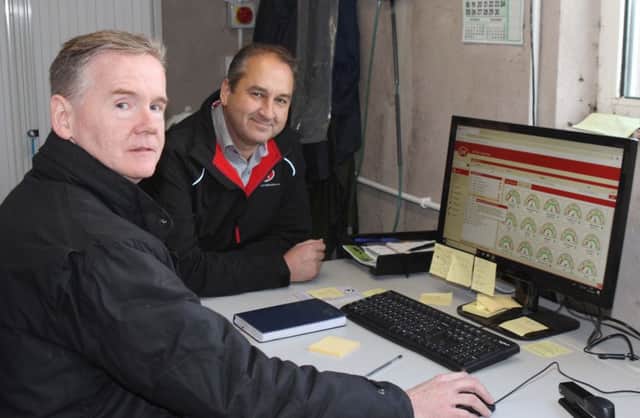 Fergal Kelly can access a wealth of information on each individual cow using Lely's T4C software. He is pictured with Jim Irwin, Lely Center Eglish. Picture: Julie Hazelton