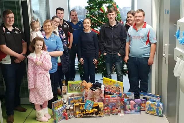Representatives from Co Armagh Young Farmers Clubs deliver gifts to Blossom unit for sick children in Craigavon Area Hospital