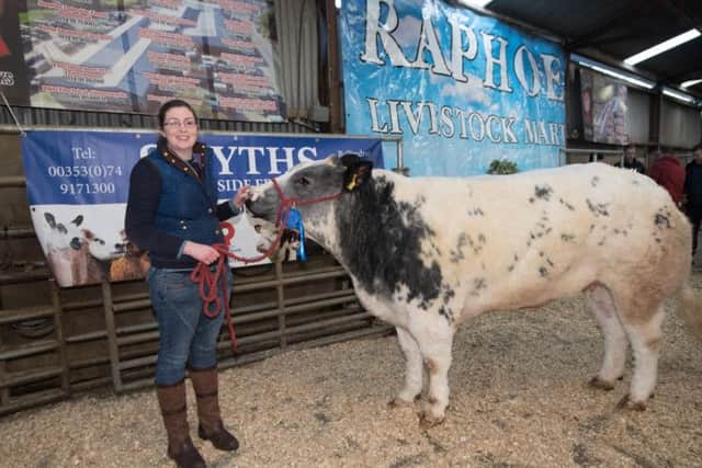 Laurna McGlinchey from Glencolmcille witht eh Reserve Cahmpion Heifer at the Raphoe Mart Fatstock Show and Sale on Friday last. Photo Clive Wasson