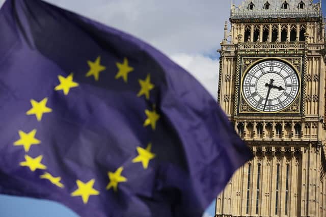 Embargoed to 0001 Monday December 5

File photo dated 02/07/16 of a European Union flag in front of Big Ben, as the Government goes to the Supreme Court today in the latest stage of the legal battle over Brexit. PRESS ASSOCIATION Photo. Issue date: Monday December 5, 2016. The highest court in the land is being asked to overturn a High Court ruling that the Prime Minister must seek MPs' approval to trigger the process of taking Britain out of the European Union. See PA story COURTS Brexit. Photo credit should read: Daniel Leal-Olivas/PA Wire