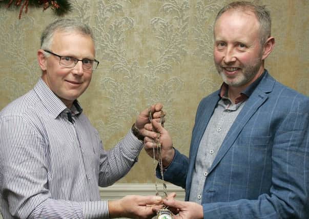 The new chairman of Fermanagh Grassland Club, Michael McCaughey (right) from Trillick, receiving the club's chain of office from John Egerton, outgoing chairman.