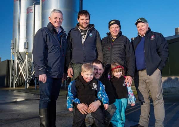 Left to right: Stephen Comer, senior business manager at First Trust Bank is pictured with four generations of the Allen family outside their new pig rearing unit. Tilly Allen, with her great granddaughter Lucy, her grandson David and son Robert