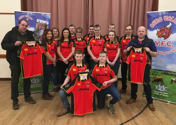 Pictured at the launch of Derg Valley YFC's new tops are sponsors, Gordon Hamilton, G H Engineering, left, and Robert Waugh, Listymore Texels, right. Also helping launch the tops are club members Josh Hamilton and Sam Waugh Elaine Wilson, Lauren Moore, Kathryn Mitchell, Robert Waugh Jnr, Sheryl Hamilton, Samuel Hunter, Mark Hamilton, Leah Hamilton, Ashley Hamilton and Gareth Hamilton