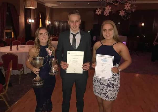 Amy Knight, Gareth Knight and Rachel Belshaw with their county dinner awards