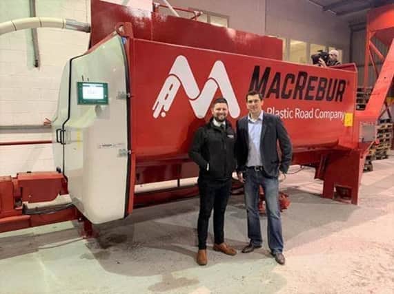 Alistair Morton, KEENAN regional sales manager, and Gordon Reid, MacRebur co-founder, with the KEENAN MechFiber300, which will be used to mix plastic waste for plastic roads.