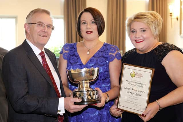The UFU South West Down group was awarded the Mary Wilson Trophy for the best overall UFU group performance in 2018. Pictured accepting the trophy is Sarah Macauley and Diane Simpson with Ivor Ferguson, UFU President.