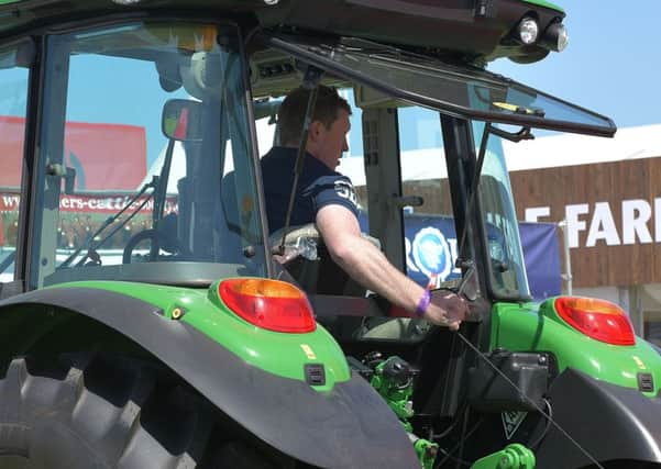 YFCU member demonstrating his tractor skills in the machinery handling competition