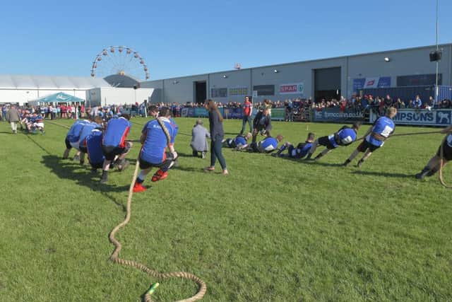 YFCU members pulling for success in the tug of war competition